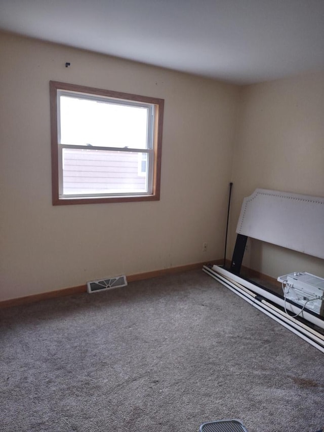1041 Sundown Ct, Mukwonago, WI 53149 - unfurnished bedroom featuring baseboards and carpet flooring