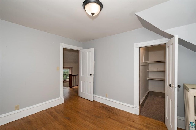1112 Baxter Ave, Superior, WI 54880 - unfurnished bedroom featuring wood finished floors, baseboards, and a closet