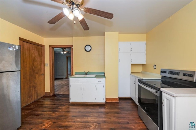 1112 Baxter Ave, Superior, WI 54880 - kitchen with stainless steel appliances, a ceiling fan, dark wood finished floors, light countertops, and a sink