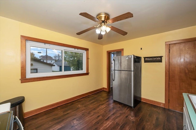 1112 Baxter Ave, Superior, WI 54880 - kitchen with freestanding refrigerator, baseboards, dark wood-type flooring, and a ceiling fan