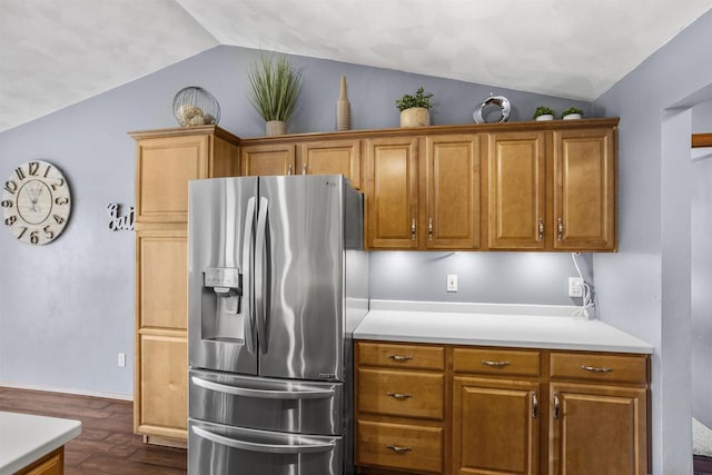 W5841 Easter Lily Dr, Appleton, WI 54915 - kitchen with stainless steel fridge, lofted ceiling, dark wood-style floors, light countertops, and brown cabinetry