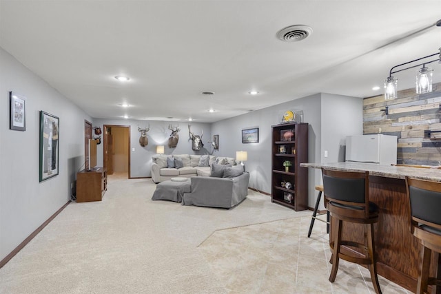 W5841 Easter Lily Dr, Appleton, WI 54915 - living area with recessed lighting, light carpet, a dry bar, and baseboards