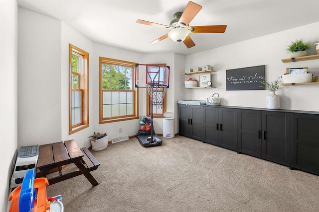 665 N Prairie Rd, Fond Du Lac, WI 54935 - living area featuring light carpet, ceiling fan, and baseboards