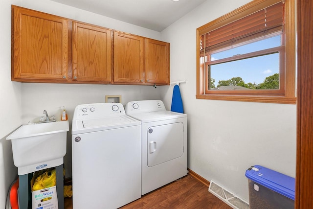 665 N Prairie Rd, Fond Du Lac, WI 54935 - laundry area featuring washing machine and dryer, cabinet space, dark wood finished floors, and baseboards