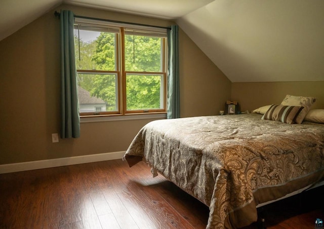 1223 Macarthur Ave, Ashland, WI 54806 - bedroom featuring lofted ceiling, wood finished floors, and baseboards