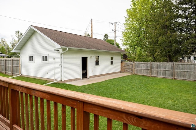 1223 Macarthur Ave, Ashland, WI 54806 - back of property featuring a shingled roof and a patio