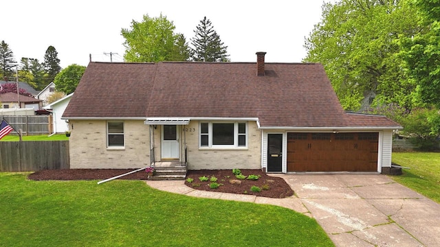 1223 Macarthur Ave, Ashland, WI 54806 - view of front of house with a garage, driveway, brick siding, and roof with shingles