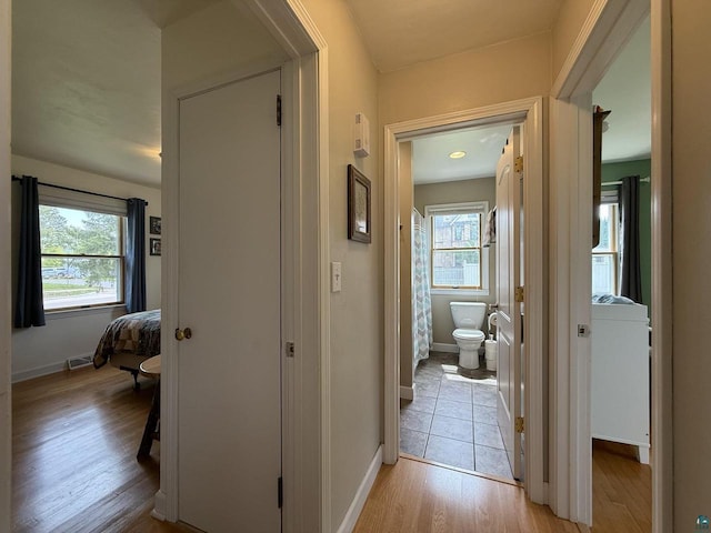 1223 Macarthur Ave, Ashland, WI 54806 - hallway featuring light wood-style flooring and baseboards