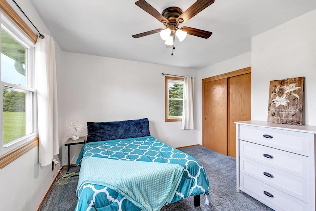 3687 Foxwoods Ln, Abrams, WI 54101 - carpeted bedroom with a closet, baseboards, and ceiling fan