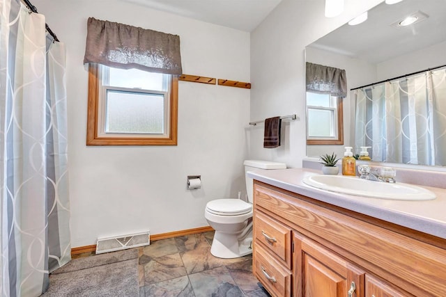 3687 Foxwoods Ln, Abrams, WI 54101 - bathroom featuring vanity, toilet, baseboards, stone finish flooring, and a shower with curtain