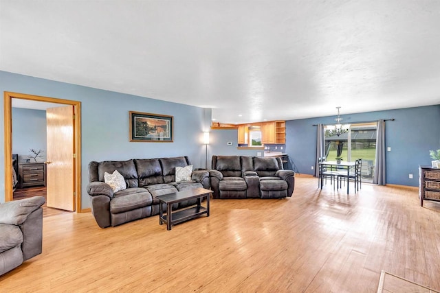 3687 Foxwoods Ln, Abrams, WI 54101 - living room featuring a chandelier and light wood-type flooring