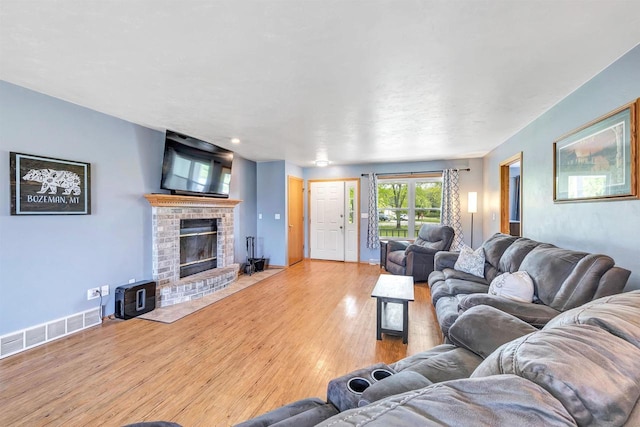 3687 Foxwoods Ln, Abrams, WI 54101 - living area featuring hardwood / wood-style flooring, a fireplace, and baseboards