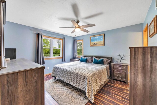 3687 Foxwoods Ln, Abrams, WI 54101 - bedroom featuring dark wood-type flooring, a ceiling fan, and baseboards