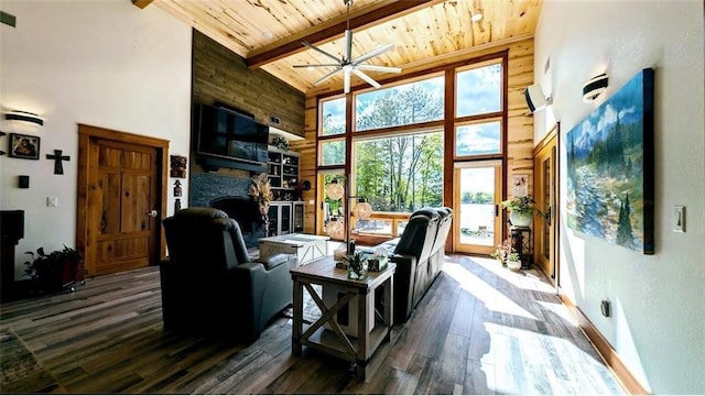 N528 Park Dr, New Auburn, WI 54757 - living room featuring high vaulted ceiling, wooden ceiling with exposed beams, a stone fireplace, dark wood finished floors, and ceiling fan