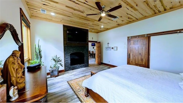 N528 Park Dr, New Auburn, WI 54757 - bedroom with wooden ceiling, wood finished floors, a fireplace, baseboards, and crown molding
