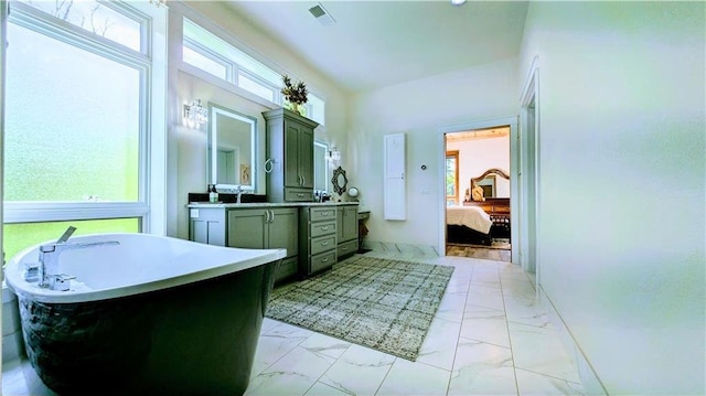 N528 Park Dr, New Auburn, WI 54757 - full bath with marble finish floors, a freestanding bath, vanity, and plenty of natural light