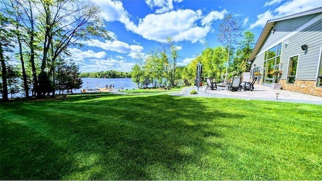 N528 Park Dr, New Auburn, WI 54757 - view of grassy yard featuring a patio area and a water view