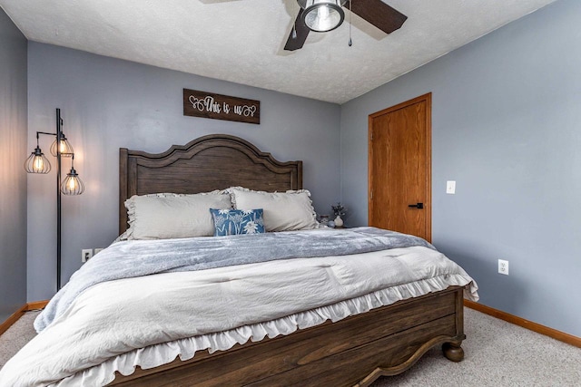 1320 Raymond Ct, Platteville, WI 53818 - bedroom featuring carpet flooring, baseboards, a ceiling fan, and a textured ceiling