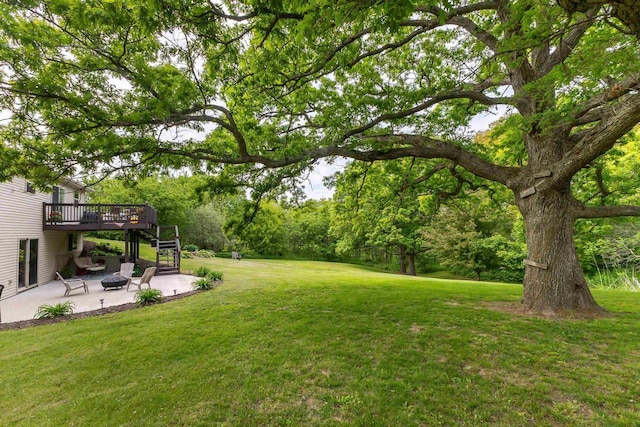 1320 Raymond Ct, Platteville, WI 53818 - view of green lawn with a patio, a deck, and stairs