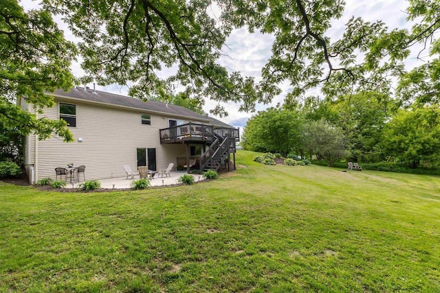 1320 Raymond Ct, Platteville, WI 53818 - view of grassy yard with a patio area, a wooden deck, and stairs