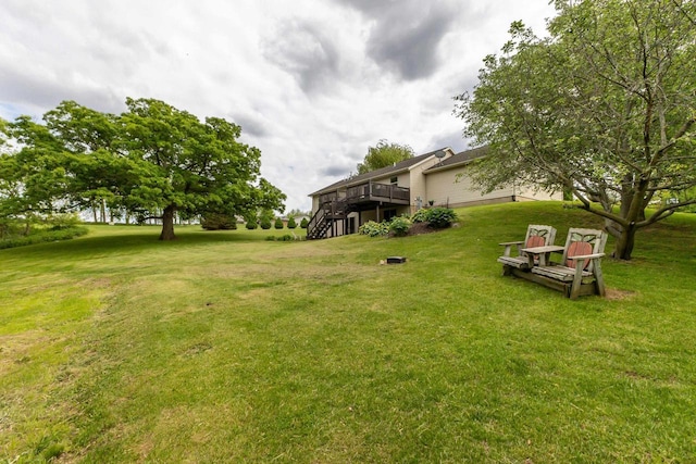 1320 Raymond Ct, Platteville, WI 53818 - view of green lawn with a wooden deck and stairway