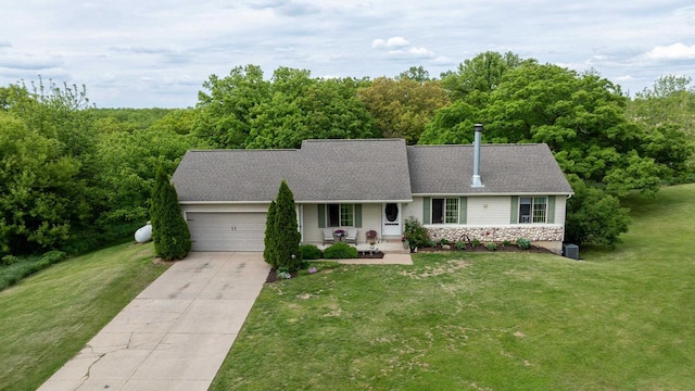 1320 Raymond Ct, Platteville, WI 53818 - view of front facade with an attached garage, a front lawn, concrete driveway, and a porch