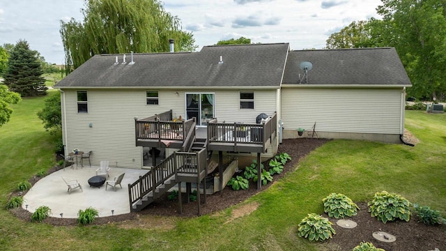 1320 Raymond Ct, Platteville, WI 53818 - back of house with a wooden deck, stairway, a patio area, a yard, and a fire pit