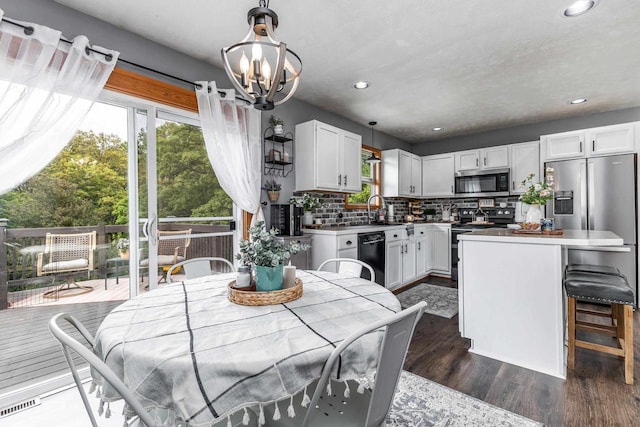 1320 Raymond Ct, Platteville, WI 53818 - dining space with dark wood-style floors, recessed lighting, and a chandelier