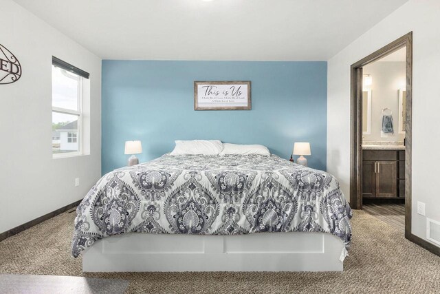 1732 Patriot Way, Neenah, WI 54956 - bedroom featuring carpet floors, ensuite bath, and baseboards