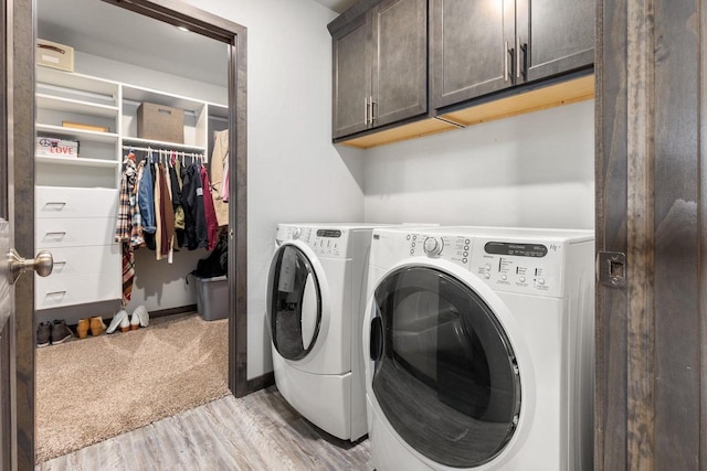 1732 Patriot Way, Neenah, WI 54956 - laundry room featuring cabinet space, independent washer and dryer, light wood-style flooring, and baseboards