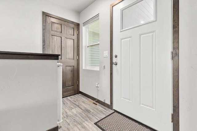 1732 Patriot Way, Neenah, WI 54956 - entryway with light wood-type flooring and baseboards