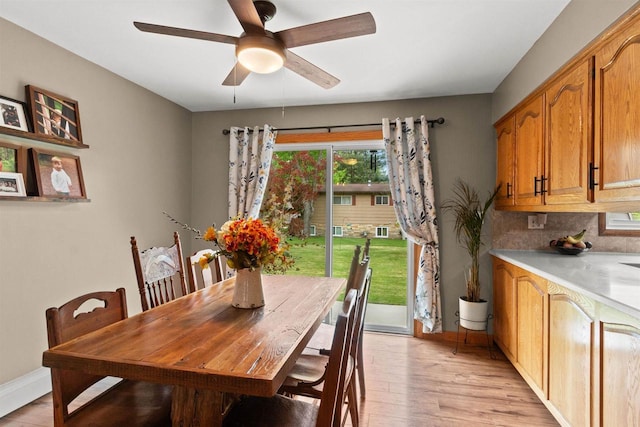 1651 4th St, Port Edwards, WI 54469 - dining room featuring a ceiling fan, light wood finished floors, and baseboards