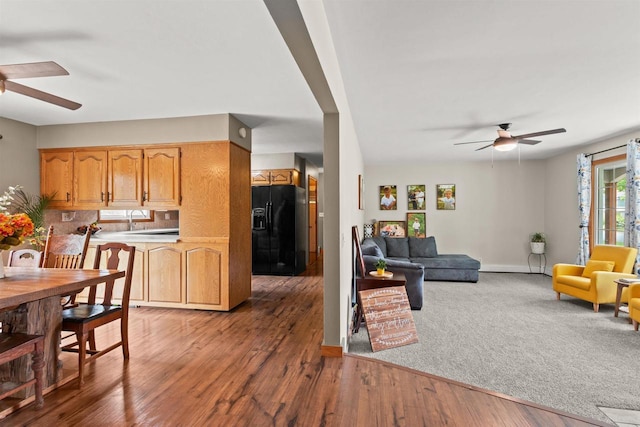 1651 4th St, Port Edwards, WI 54469 - living room featuring ceiling fan, wood finished floors, and baseboards
