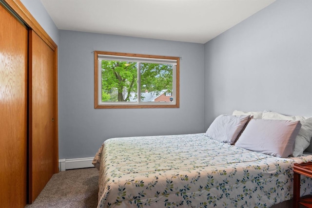 1651 4th St, Port Edwards, WI 54469 - bedroom with a baseboard heating unit, carpet floors, a closet, and baseboards