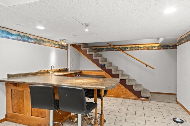 1651 4th St, Port Edwards, WI 54469 - indoor wet bar featuring baseboards, stairway, and recessed lighting