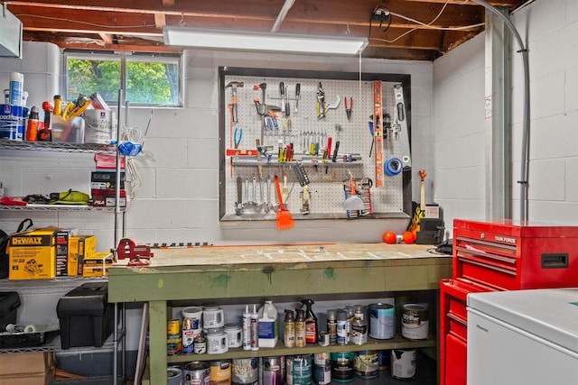 1651 4th St, Port Edwards, WI 54469 - basement featuring a workshop area, refrigerator, and concrete block wall