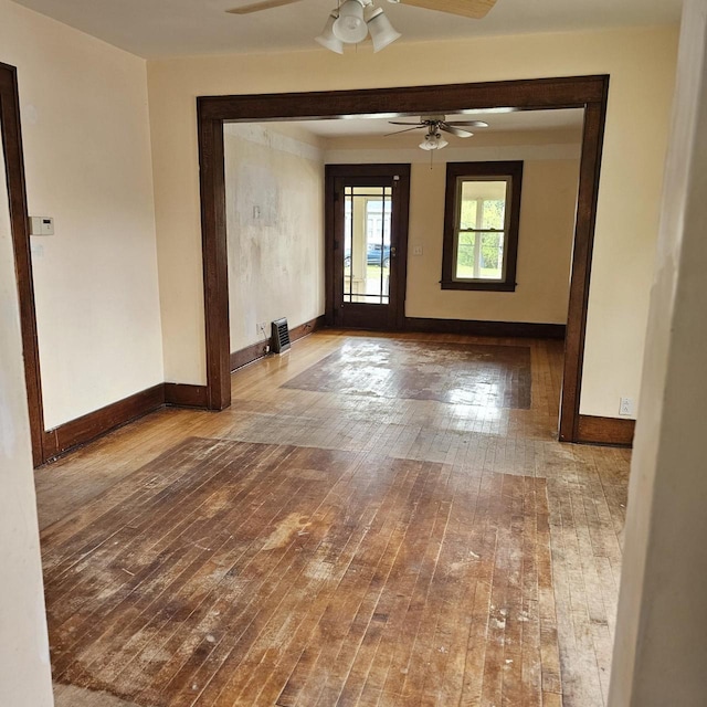 1048 W Wisconsin St, Portage, WI 53901 - spare room with a ceiling fan, hardwood / wood-style floors, and baseboards