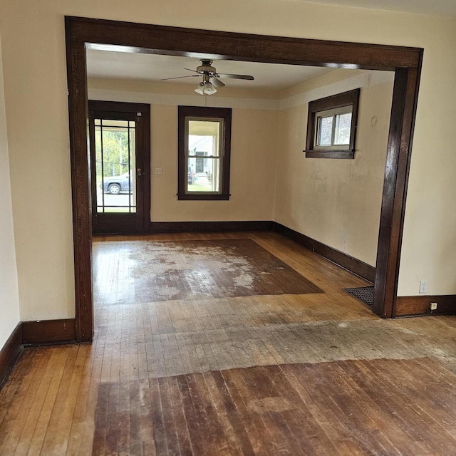 1048 W Wisconsin St, Portage, WI 53901 - spare room featuring hardwood / wood-style floors, a ceiling fan, and baseboards