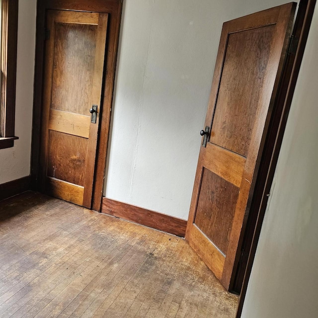 1048 W Wisconsin St, Portage, WI 53901 - unfurnished room with hardwood / wood-style flooring and baseboards