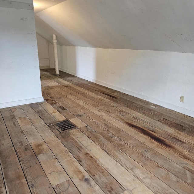 1048 W Wisconsin St, Portage, WI 53901 - additional living space with wood-type flooring and vaulted ceiling