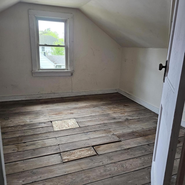 1048 W Wisconsin St, Portage, WI 53901 - additional living space with lofted ceiling and hardwood / wood-style flooring