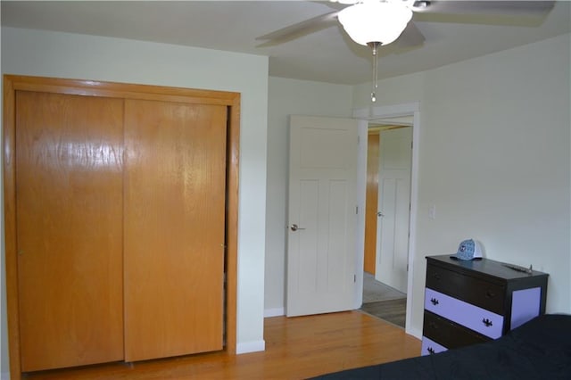 1905 E Clairemont Ave, Eau Claire, WI 54701 - bedroom with wood finished floors, a closet, baseboards, and a ceiling fan