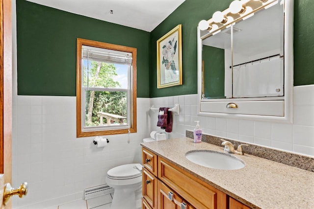 4705 Winnequah Rd, Monona, WI 53716 - full bathroom featuring tile walls, baseboard heating, toilet, vanity, and tile patterned floors