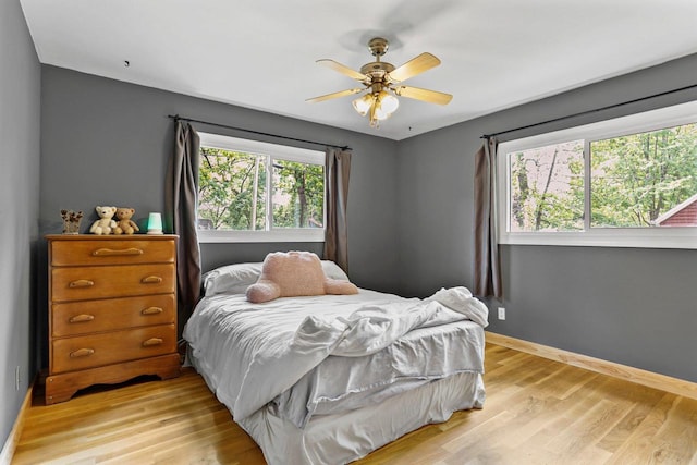 4705 Winnequah Rd, Monona, WI 53716 - bedroom with light wood-style floors, baseboards, and ceiling fan