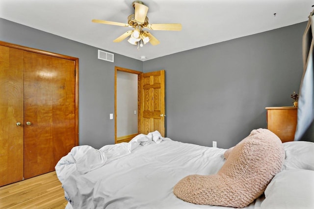 4705 Winnequah Rd, Monona, WI 53716 - bedroom with wood finished floors, a closet, and a ceiling fan