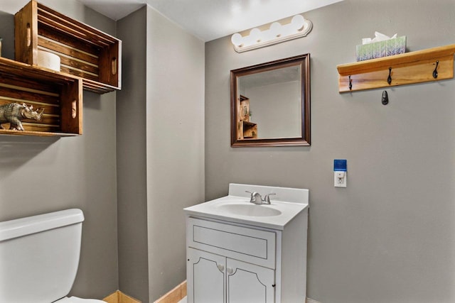 4705 Winnequah Rd, Monona, WI 53716 - bathroom with vanity, toilet, and baseboards