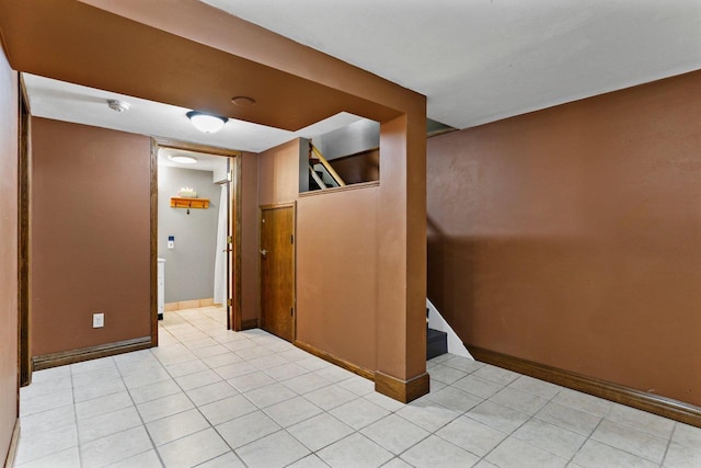 4705 Winnequah Rd, Monona, WI 53716 - spare room featuring light tile patterned floors, baseboards, a smoke detector, and stairway