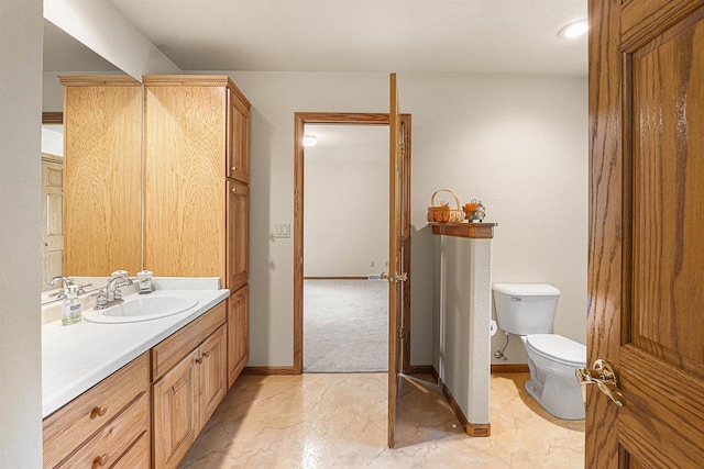 705 Red Fox, Fond Du Lac, WI 54937 - bathroom featuring vanity, toilet, and baseboards