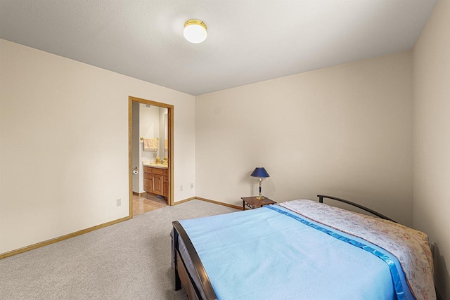 705 Red Fox, Fond Du Lac, WI 54937 - bedroom with light colored carpet, baseboards, and ensuite bathroom
