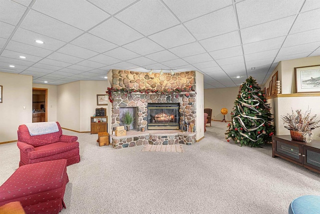705 Red Fox, Fond Du Lac, WI 54937 - carpeted living room featuring a stone fireplace, recessed lighting, baseboards, and a paneled ceiling